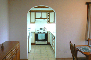 The kitchen is spacious and modern.